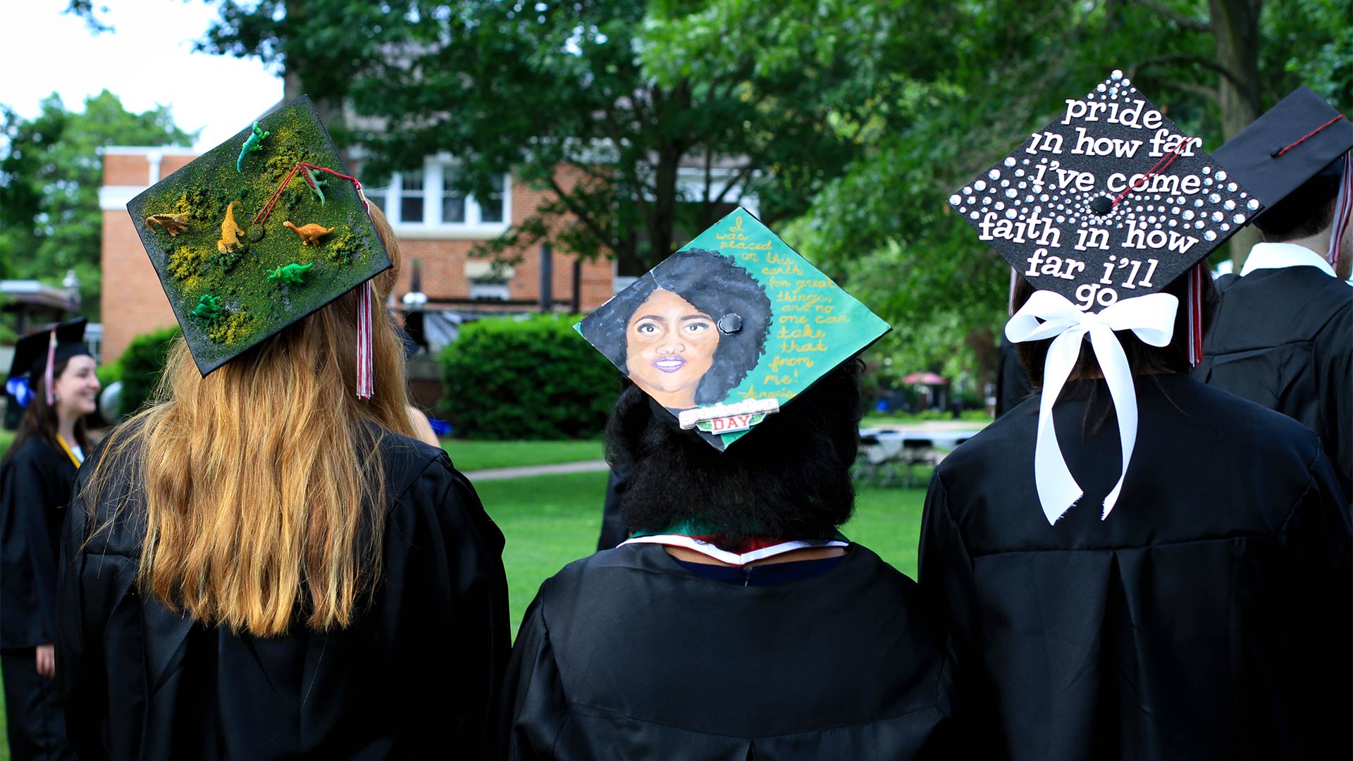 Students show off their decorated mortarboards.