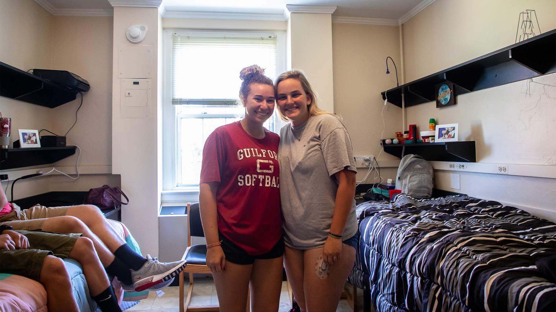 New roommates pause for a photo on move-in day.