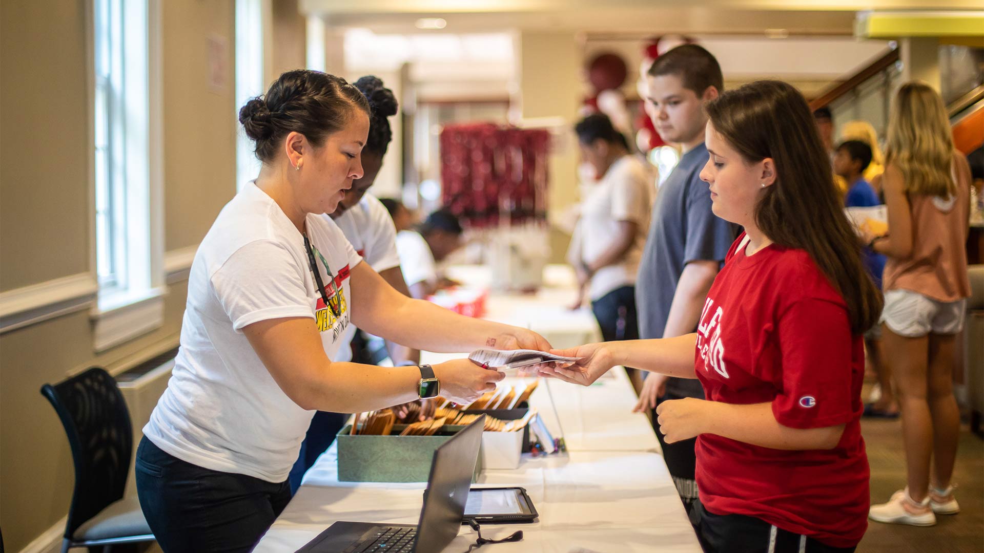 First-year students receive their res-hall room access cards at Founders Hall.