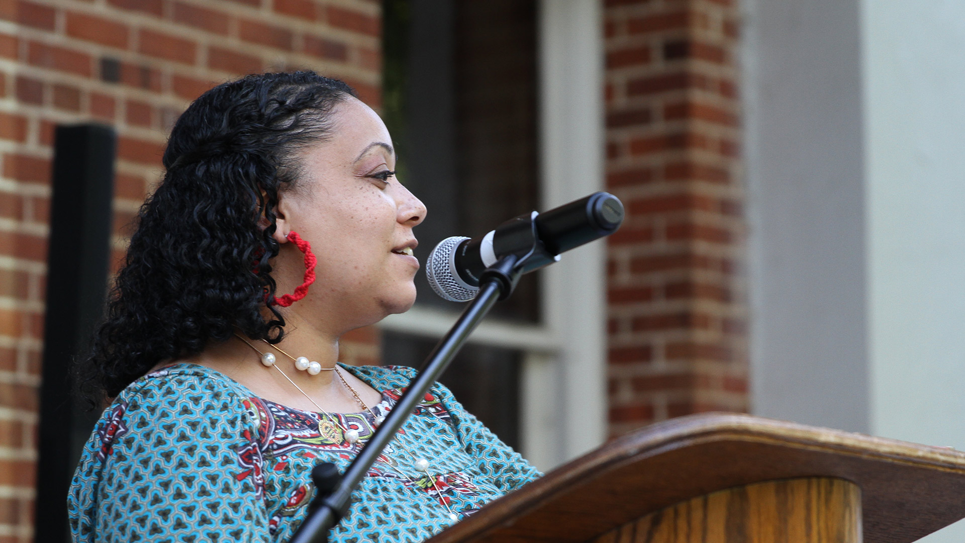 A speaker stands at the podium at the Sankofa celebration on May 6, 2021.