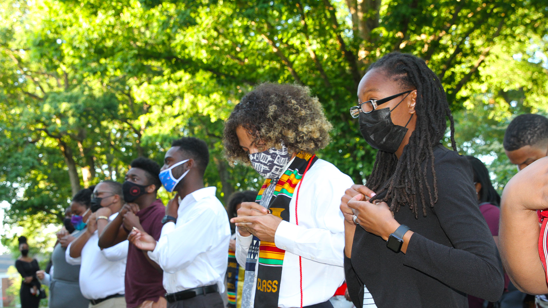 Students put on their pins at the Sankofa celebration on May 6, 2021.