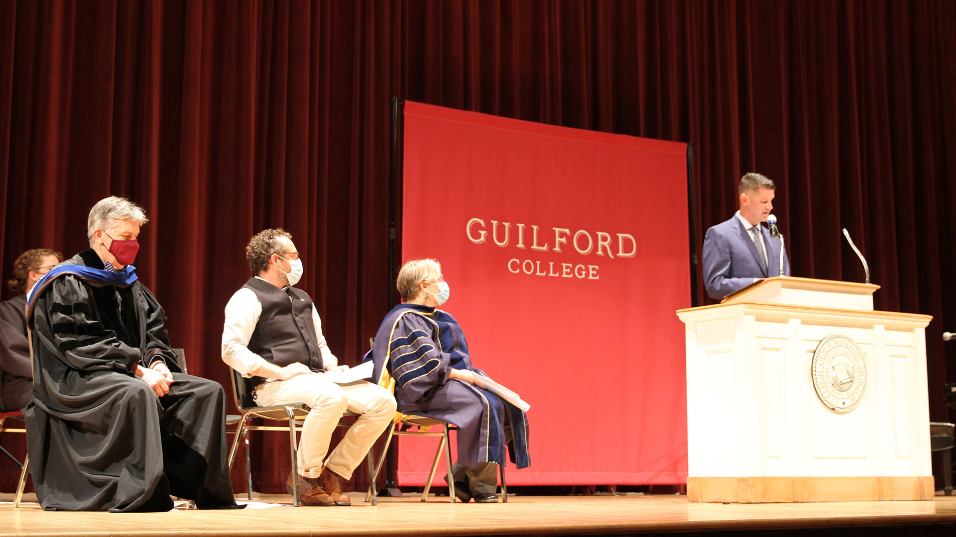 Guilford alumni Tracy Russ '90 speaks from the podium.