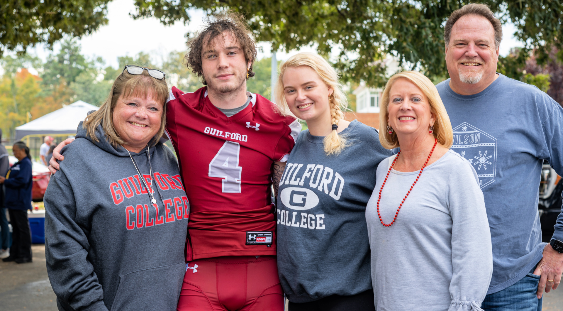 Family and friends take a photo with their Guilford football player.