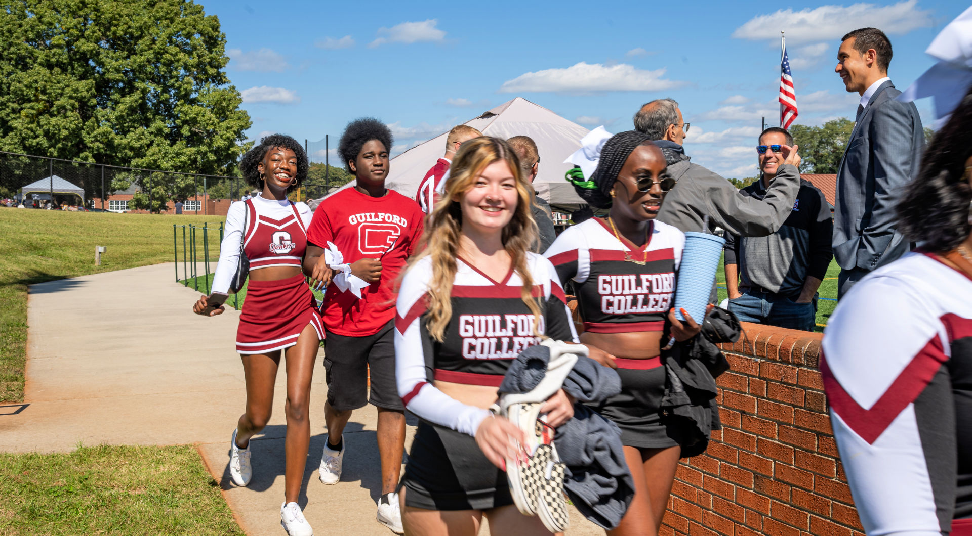 Members of Guilford's cheer team head into the stadium for the football game.