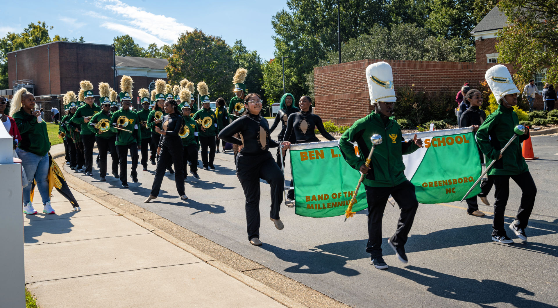 A local high school marching band performs as it heads into the stadium at Homecoming.