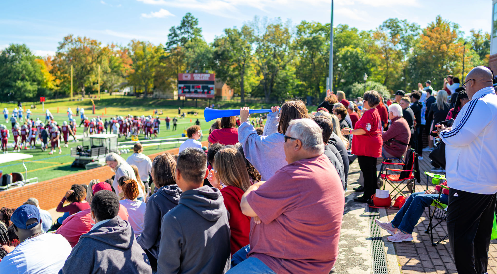 A crowd fills the stands during the Homecoming football game.