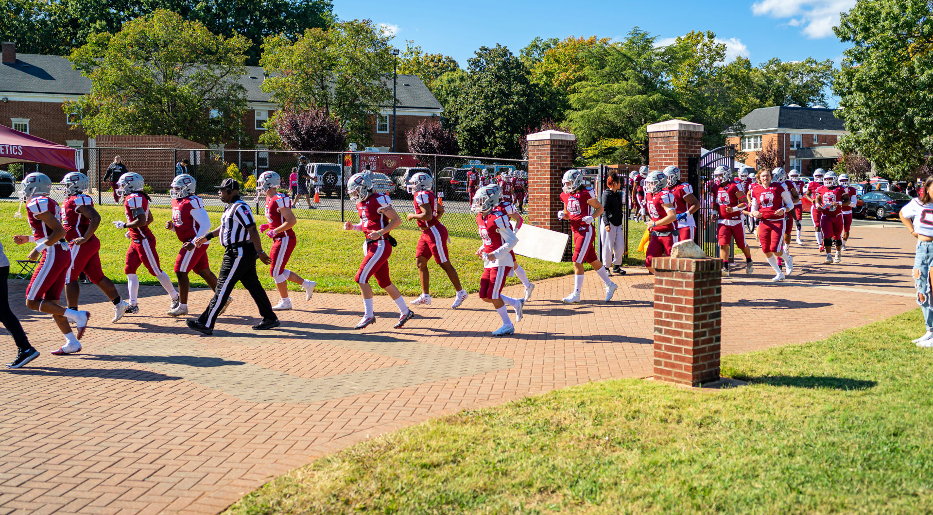 The football team heads into the stadium.