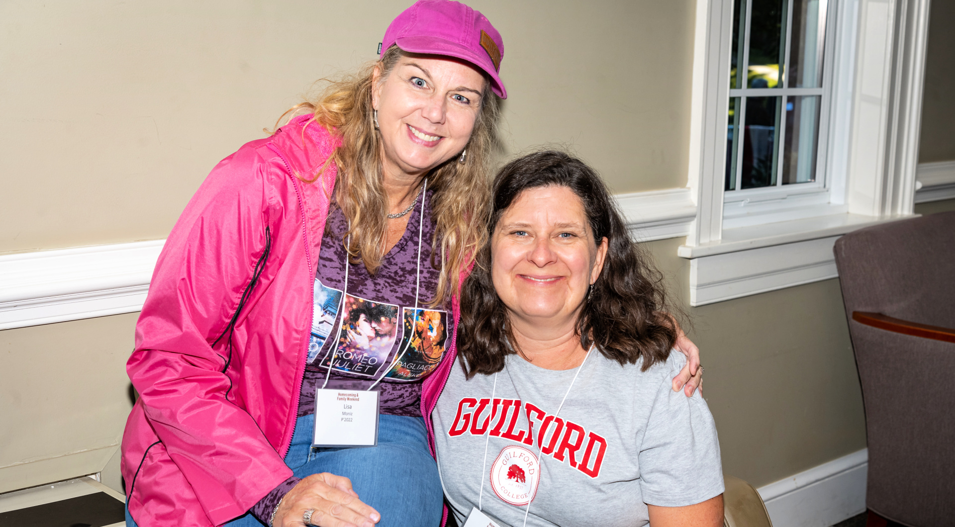 Two Guilfordians take a photo inside Founders Hall.