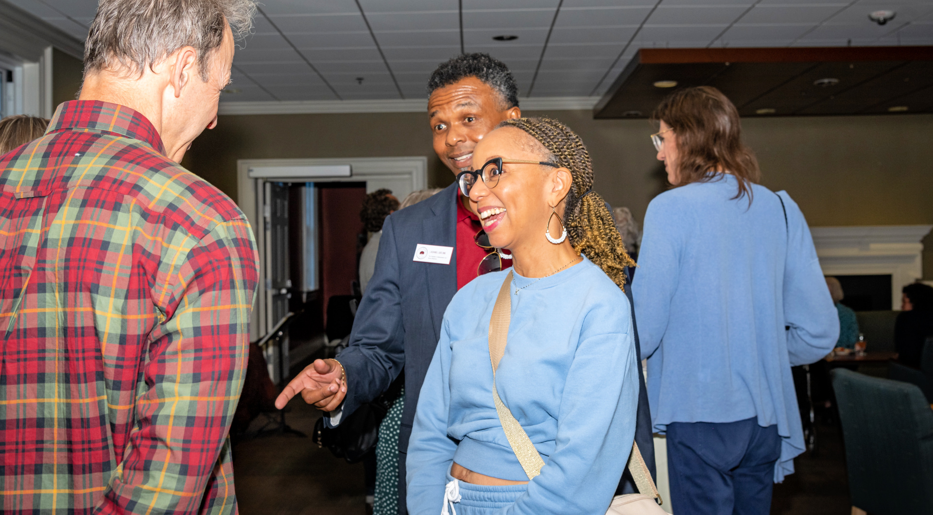 Guilfordians greet each other and chat in Founders Hall.