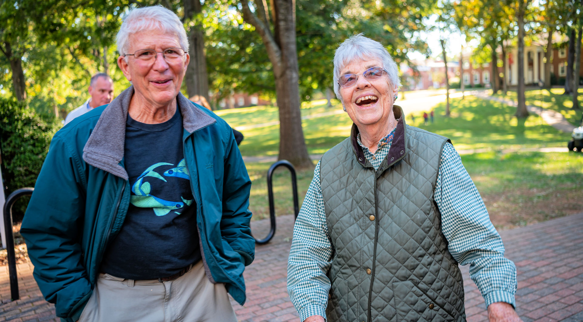 Two Guilfordians smile from the Quad.