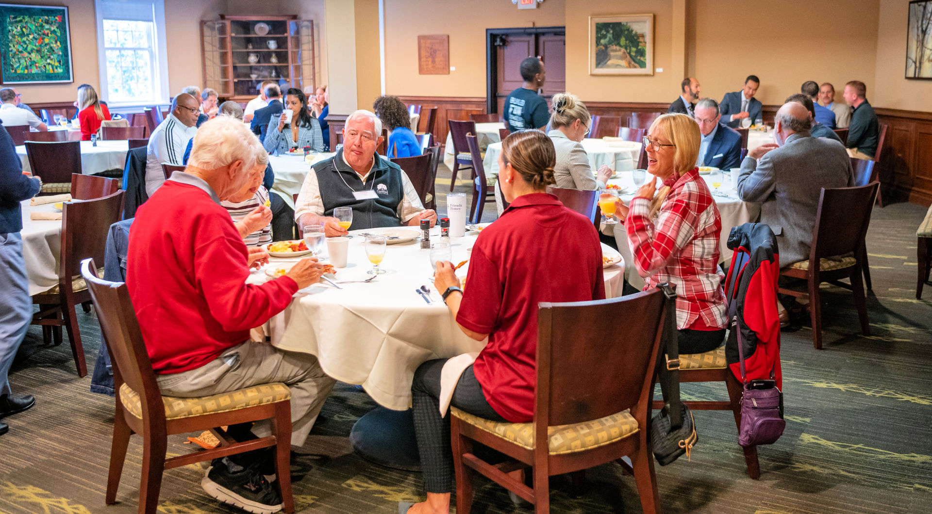 Guilfordians and guests fill the tables during a luncheon in the Gilmer Room.