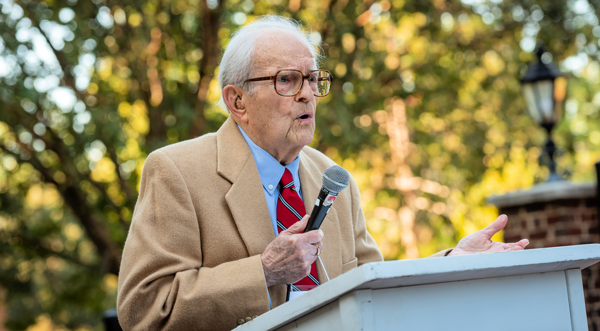 Retired Professor Paul Zopf speaks at the event to dedicate the gazebo in honor of him and his wife, Evelyn.