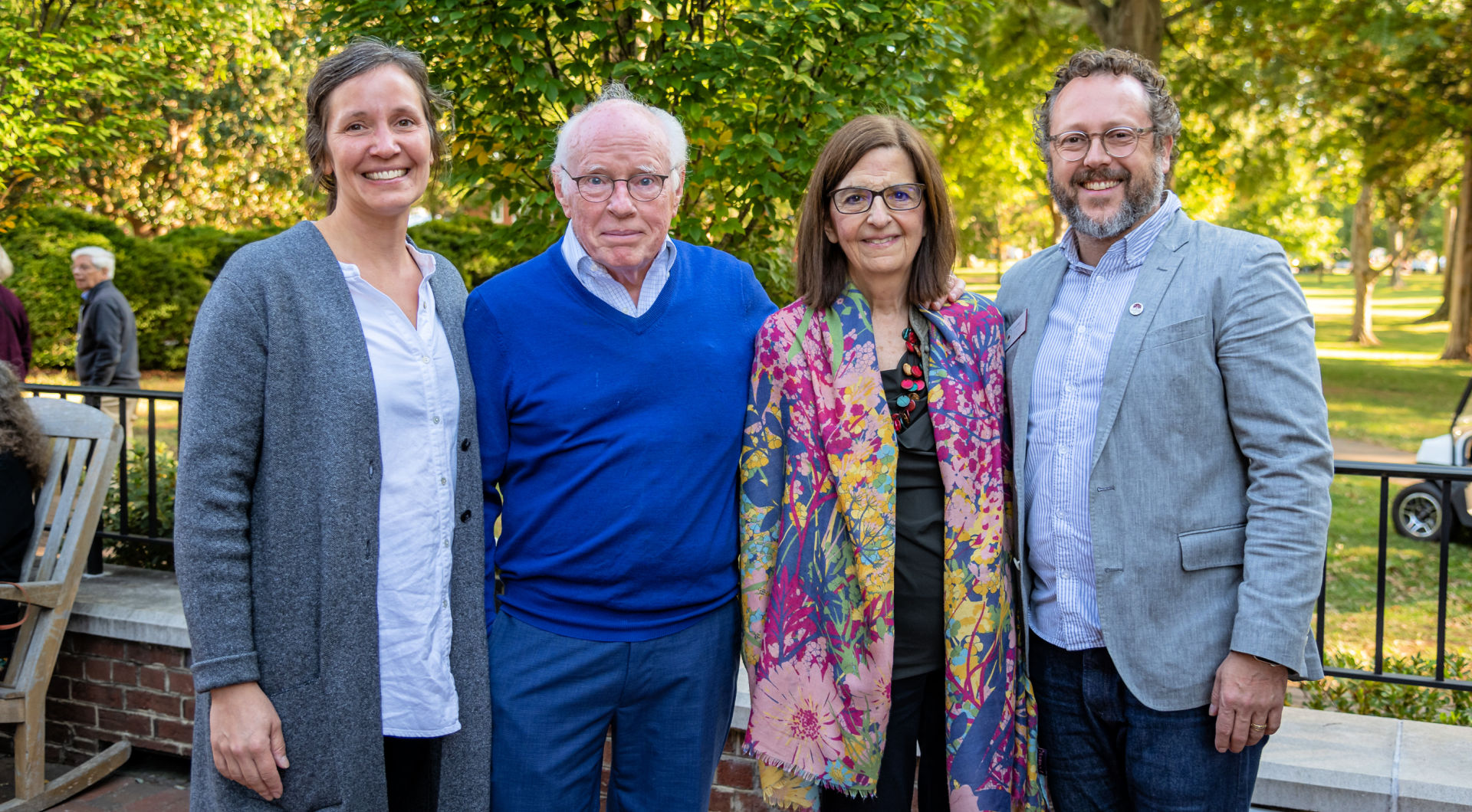 William R. Rogers Director of Friends Center Wess Daniels (far right) stands with three Guilfordians for a photo.