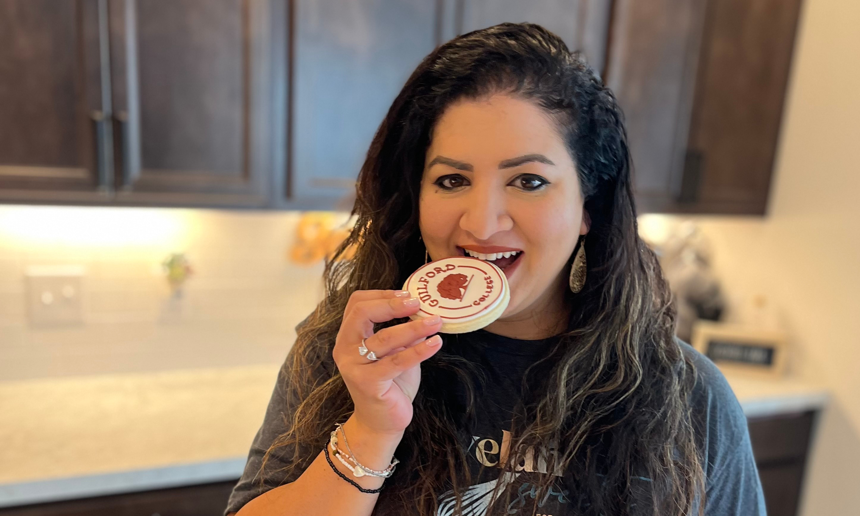 Dima Kash eating a Guilford College cookie