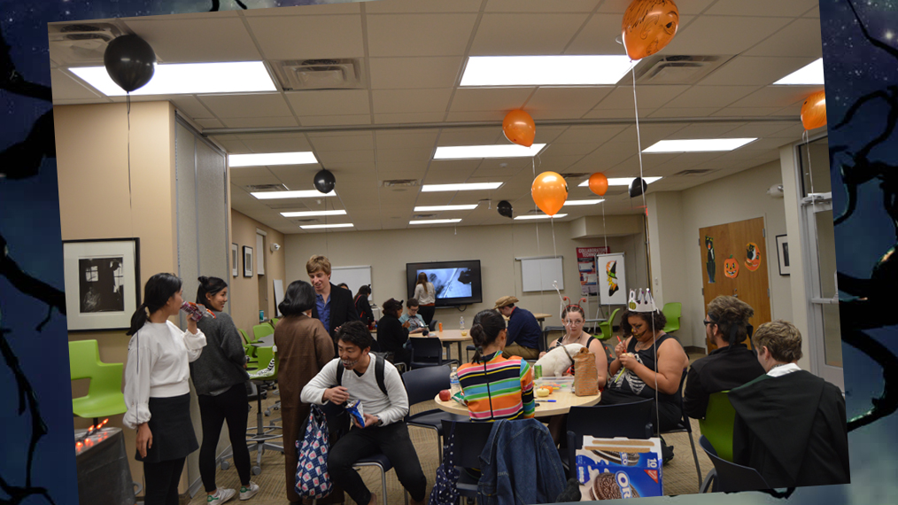 Students enjoy games and snacks on Halloween.